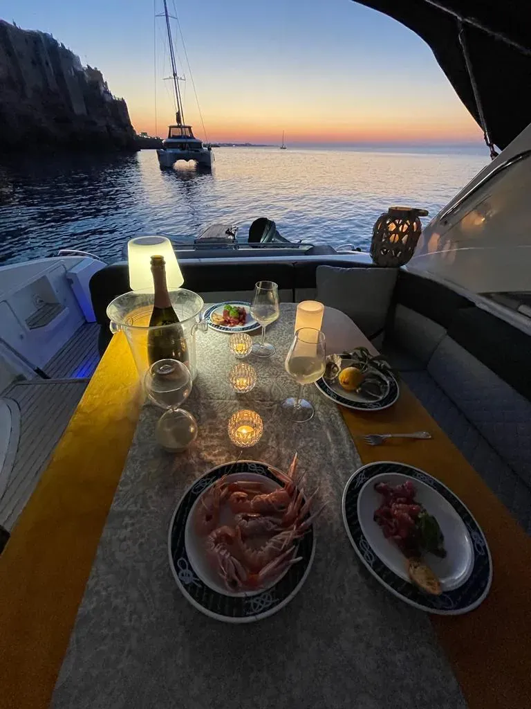 Private dinner set on a yacht at sunset